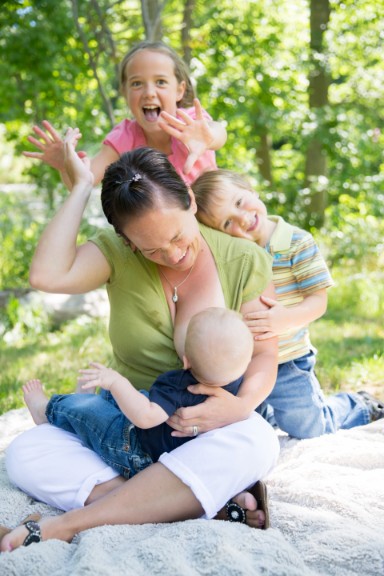 Breastfeeding mother with her children